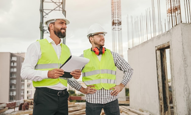 Male engineers working on construction site