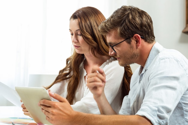 Male and female colleagues brainstorming at office