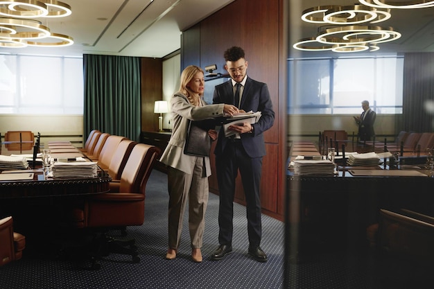 Male and Female Counselors Doing Paperwork in Exquisite Boardroom