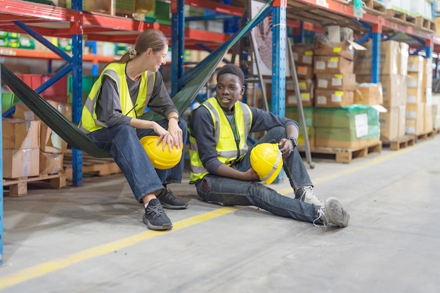 Male and female employees sit and chat