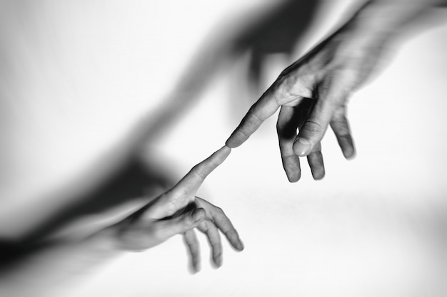 Male and female hands connected with each other together and forever. toned.