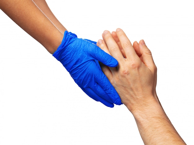 Male and female hands in medical gloves stretch to each other