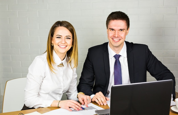 Male and female office workers.