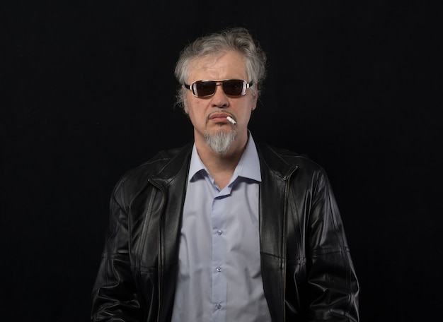 male filmmaker with a megaphone on a black background