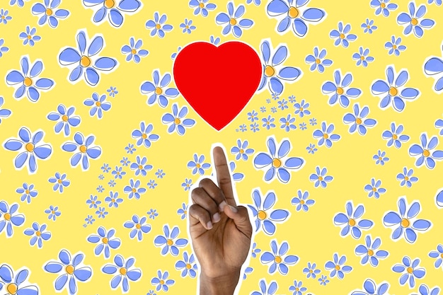 그려진 붉은 심장을 가리키는 남성 손가락 배경에 꽃 복사 공간 사랑 로맨틱 컨셉 아트 콜라주