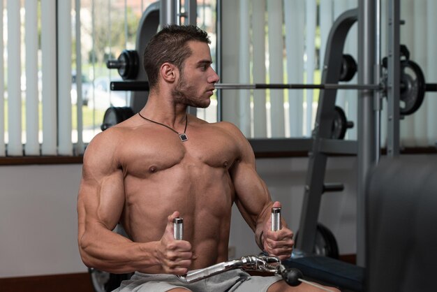 Male Fitness Athlete Doing Heavy Weight Exercise For Back
