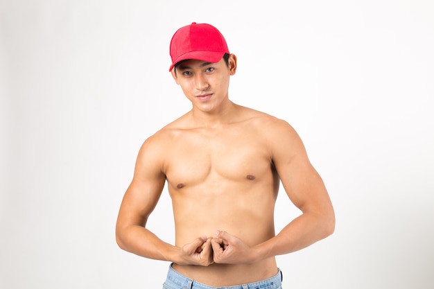 Male fitness model show strong body.  Studio shot on white background. Fitness concept