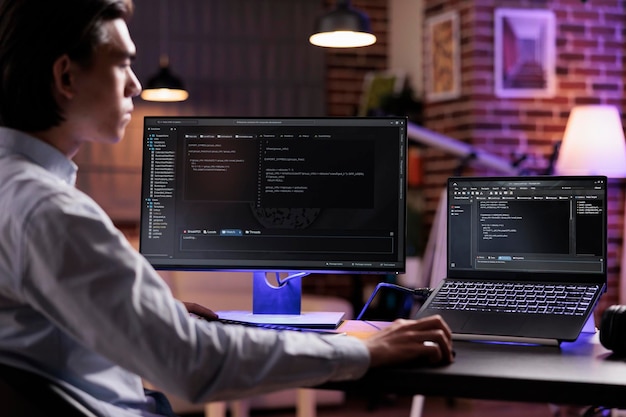 Male freelancer programming server encryption on firewall software, using security network interface to code system data for app development. Working with binary code text to script program.