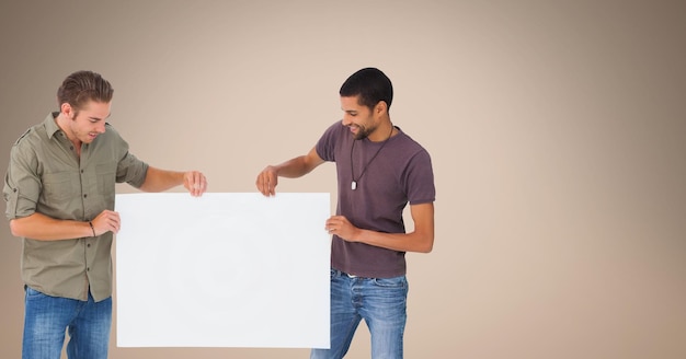 Male friends holding blank billboard against beige background