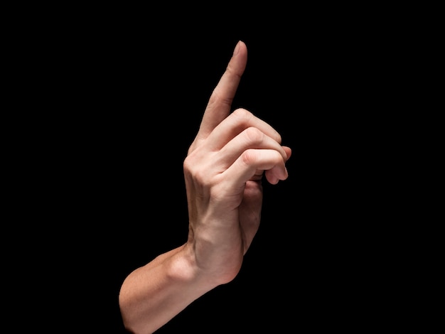 Male hand on a black background