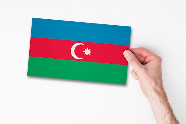 Male hand holding azerbaijan flag