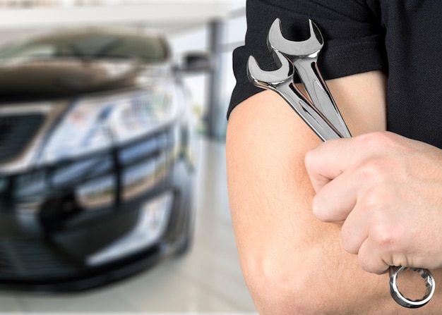 Male hand holding car tools