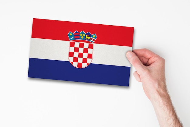 Male hand holding croatia flag