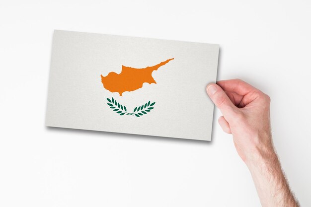 Male hand holding cyprus flag