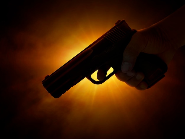 Male hand holding gun on black background with smoke yellow orange red white colored back lights