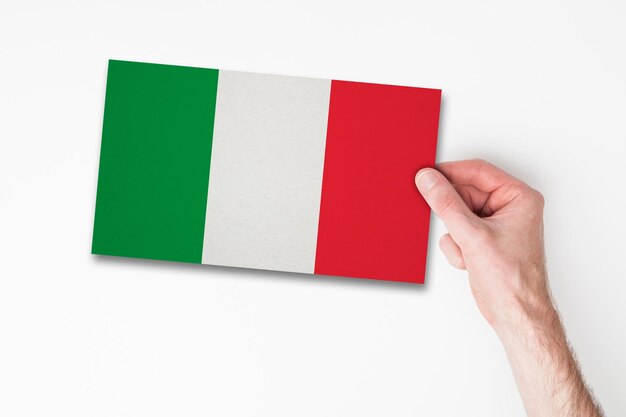 Male hand holding italy flag