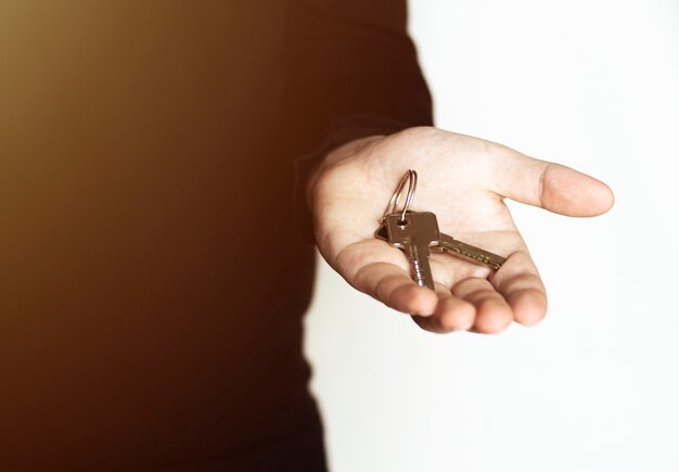 Male hand holding keys