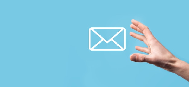 Male hand holding letter icon,email icons .Contact us by newsletter email and protect your personal information from spam mail. Customer service call center contact us.Email marketing and newsletter.