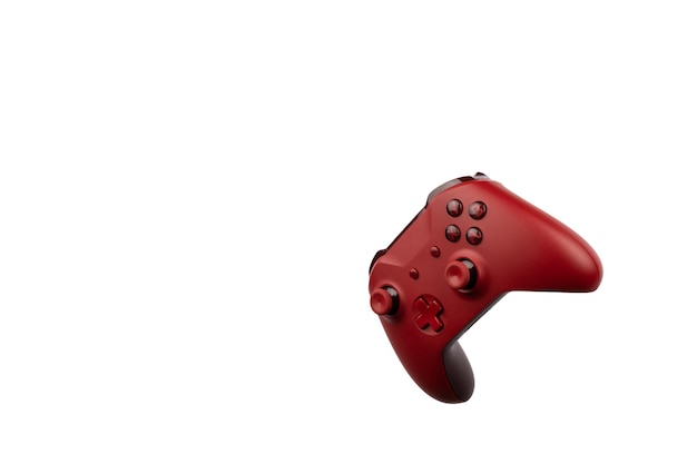 Male hand holding a red game controller isolated on white background