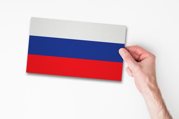 Male hand holding russia flag