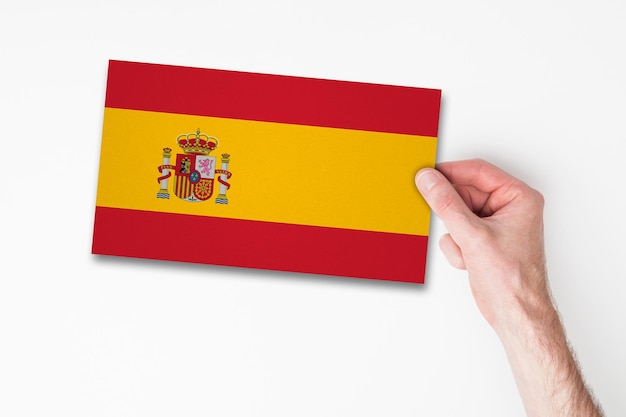 Male hand holding spain flag