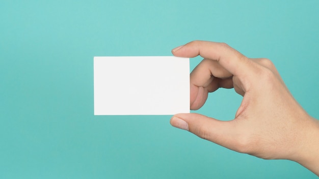 Male hand holding white blank card