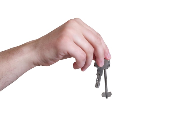 Male hand holds the keys on a white background