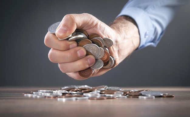 Male hand showing coins. Business. Finance