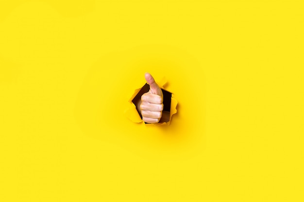 male hand showing thumb up gesture