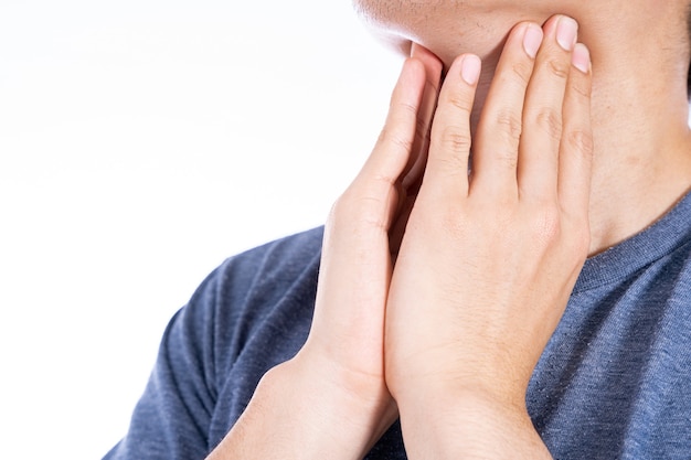 Male hand touching thyroid nodule isolated white.