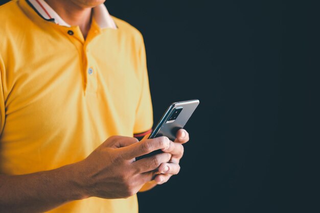 Male hand using a mobile phone Chat talk talk over a modern wireless network