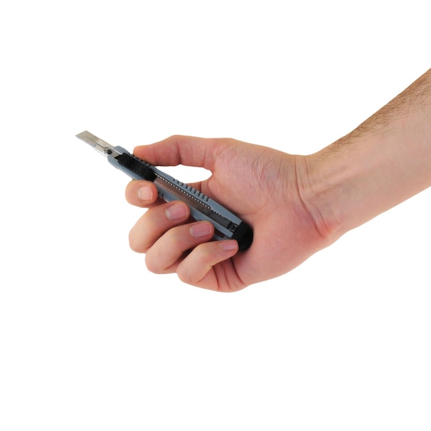 male hand using utility knife isolated