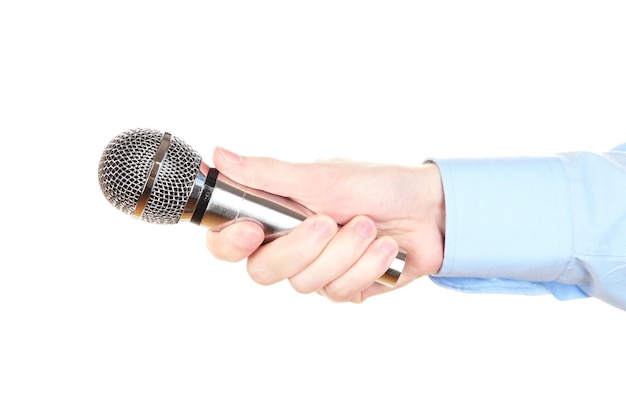 Male hand with microphone isolated on white