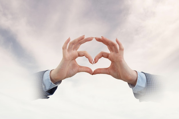 Male hands form heart shape. Mixed media