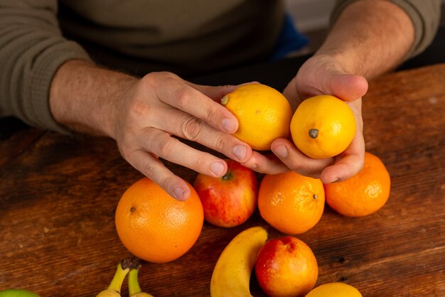 male hands holding fruit at home