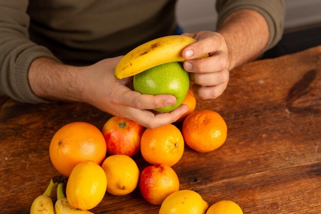 male hands holding fruit at home