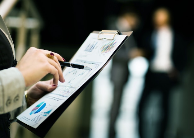  male hands pointing at business document 