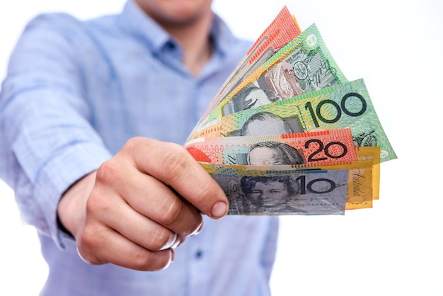 Photo male hands showing australian dollar banknotes close up