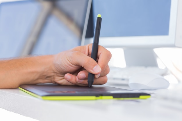 Male hands using a graphics tablet