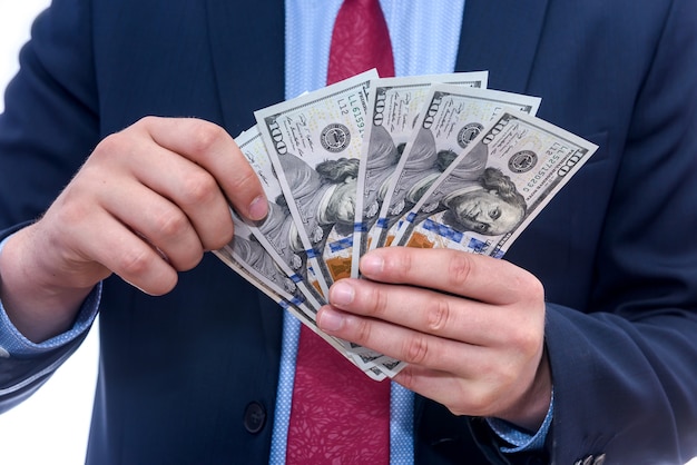 Male hands with dollar banknotes close up