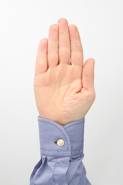 Male hands with raised fingers on a white background