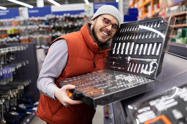 Male happy owner of a new set of car repair tools