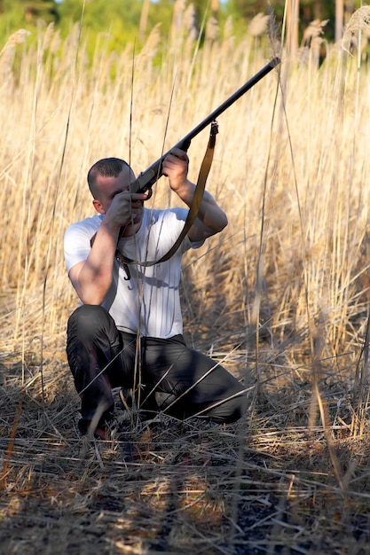 Male hunter aiming the hunt during a hunting party