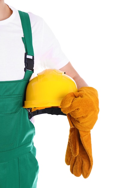 Lavoratore industriale maschio in uniforme su sfondo bianco primo piano dotazioni di sicurezza