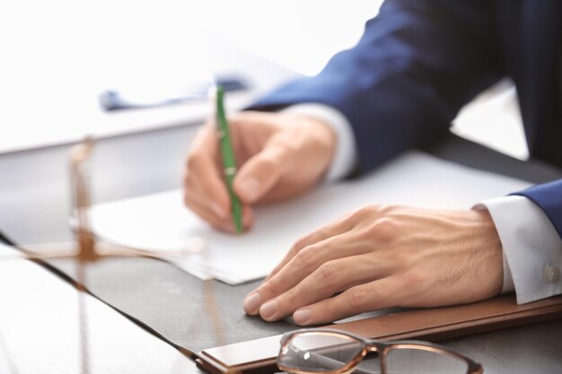 Male lawyer working in office closeup