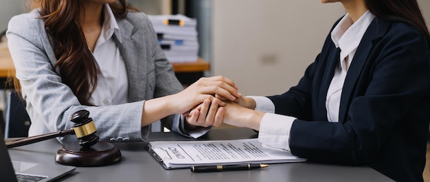 Male lawyer working with contract papers and wooden gavel on tabel in courtroom justice and law attorney court judge concept