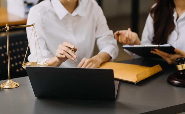 Male lawyer working with contract papers and wooden gavel on tabel in courtroom justice and law attorney court judge concept