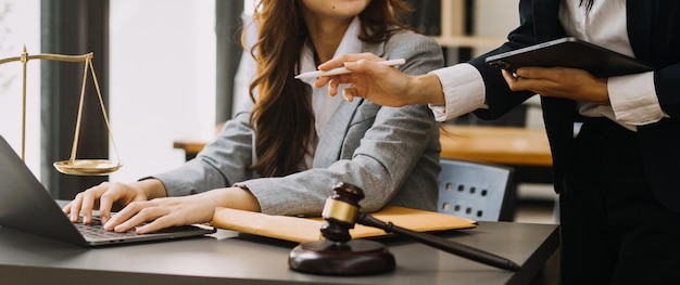 Male lawyer working with contract papers and wooden gavel on tabel in courtroom justice and law attorney court judge concept