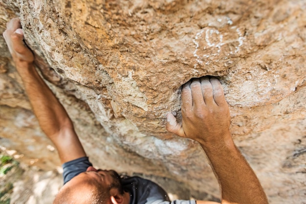 male left hand with chalk powder in cliff climbing sport, Ao Nang, Krabi, Thailand
