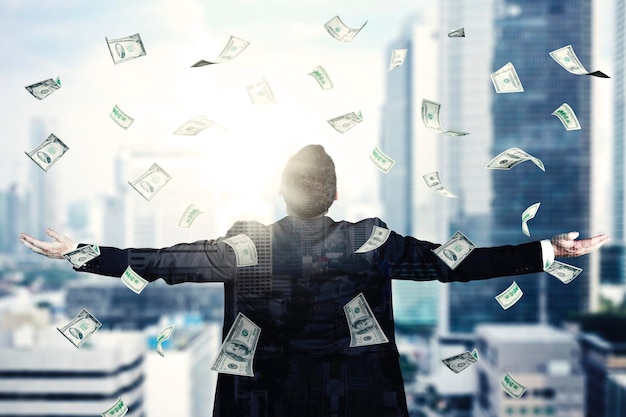 male manager outstretched arms under falls money